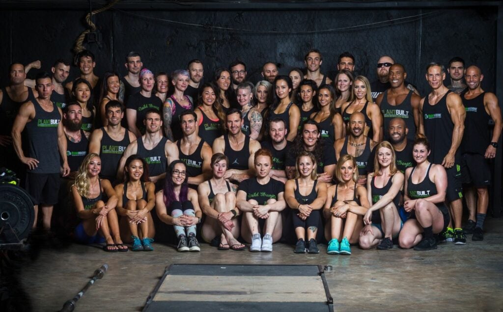 A group of vegan athletes posing for a photo