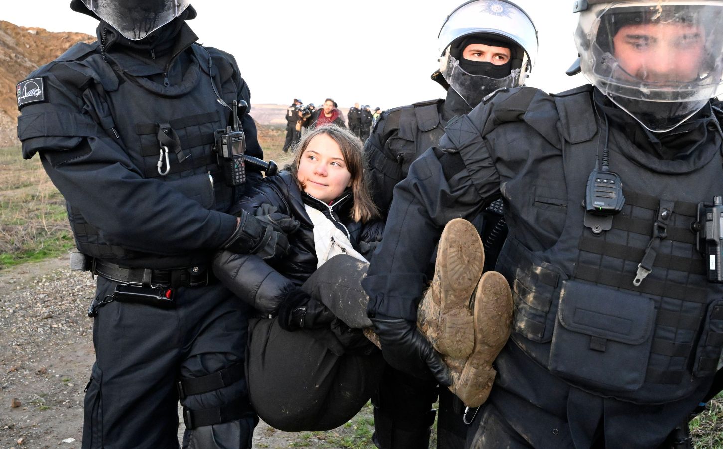 Vegan climate activist Greta Thunberg being carried away from a protest by the police