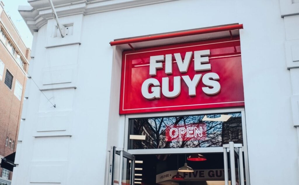 The exterior of a Five Guys fast-food restaurant in the UK