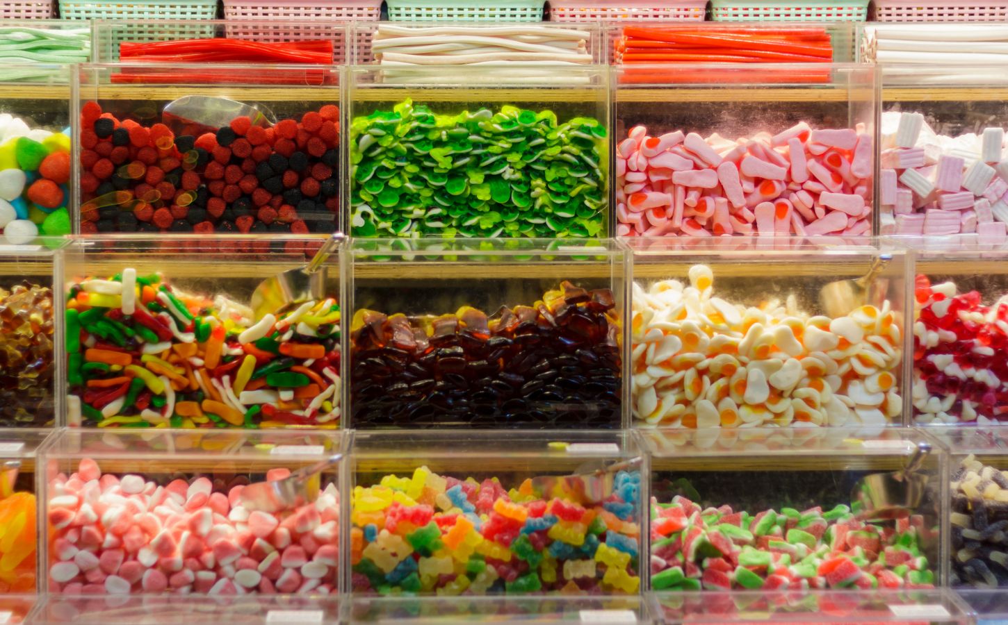 Wide shot of colorful pick and mix sweets with gelatin. Vegan sweets are available