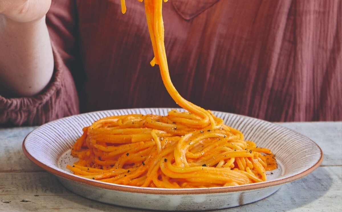 Vegan recipe developer Madeleine Olivia eating vegan high protein pepper pasta
