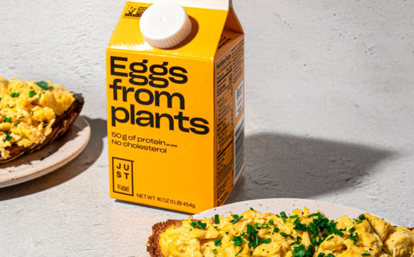 A packet of JUST Egg next to some vegan scrambled egg