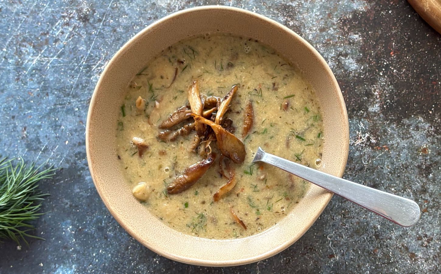 a vegan mushroom and white bean soup with lemon and tahini